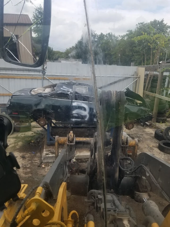 View of a junked car at One Way Auto Parts Inc.