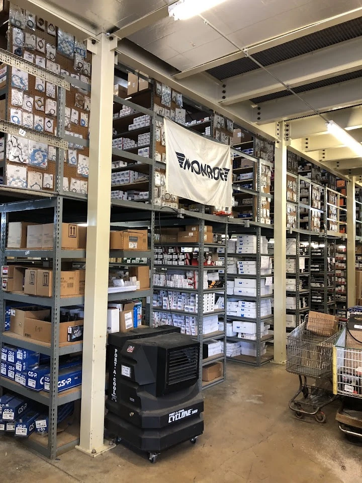 Warehouse interior filled with auto parts and supplies.