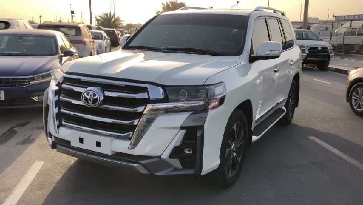 White Toyota SUV parked in a lot.