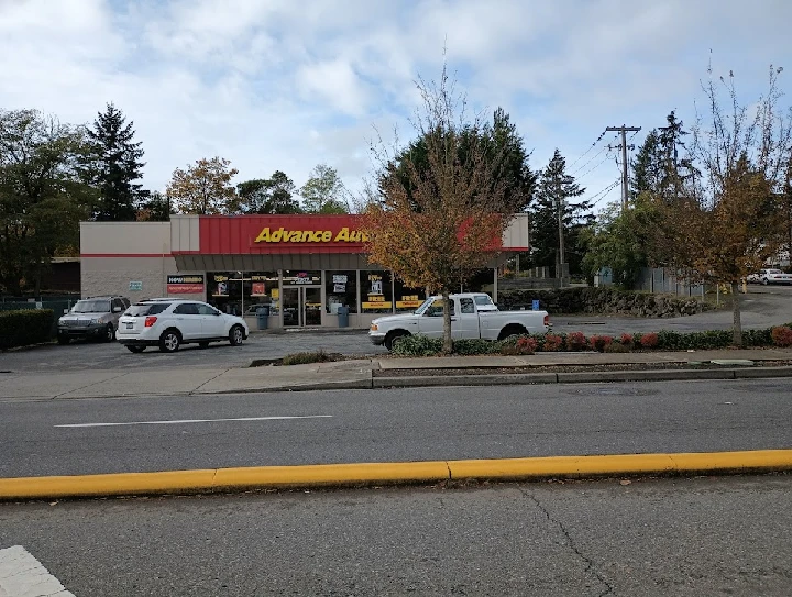 Advance Auto Parts store with parked cars outside.