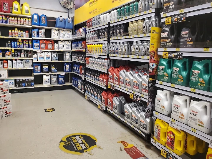 Aisle of automotive oils and fluids for sale.