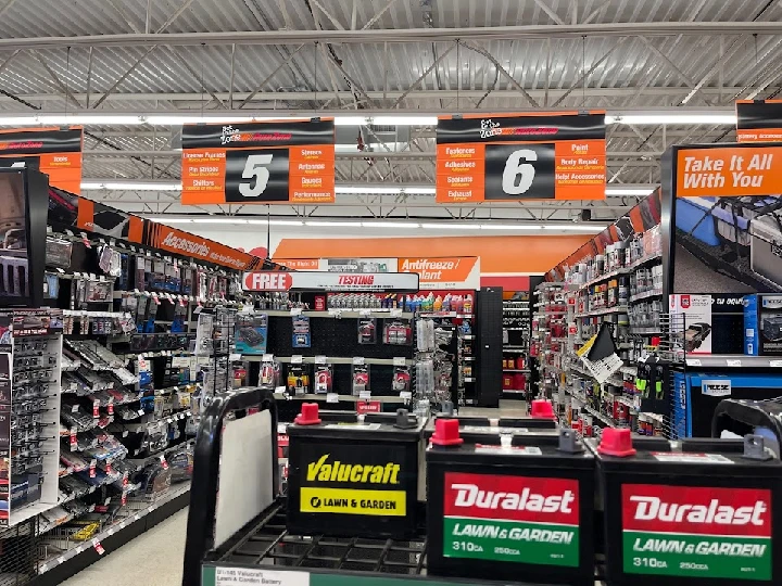 Auto parts aisle at AutoZone store with products.