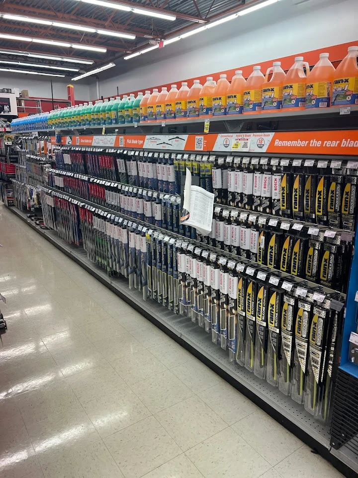 Auto parts aisle with various products displayed.