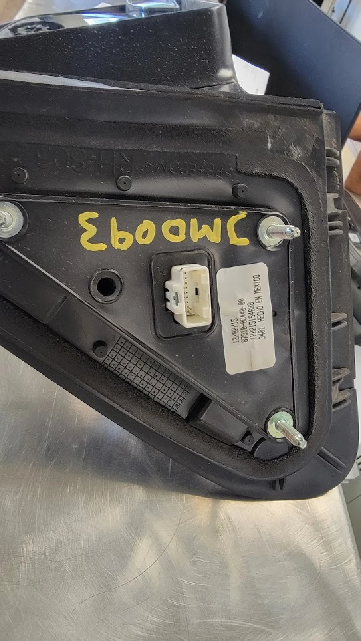 Auto parts component with label and connectors.