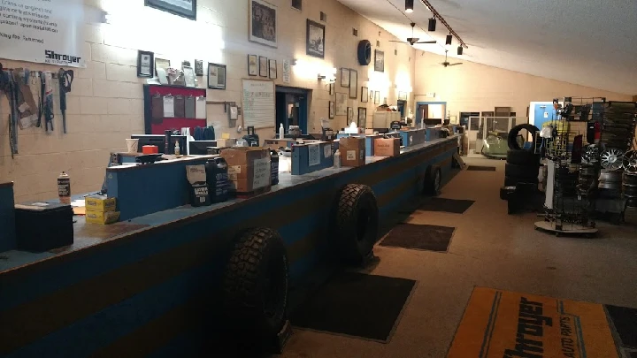 Auto parts shop interior with service counters.