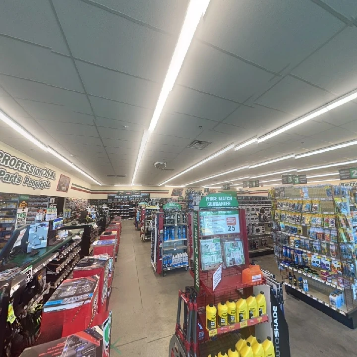 Auto parts store aisle stocked with various items.