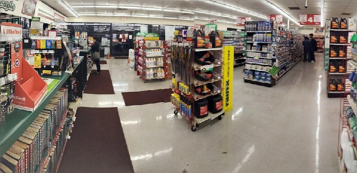 Auto parts store aisle with various products displayed.