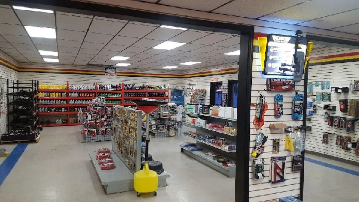 Auto parts store interior with various products displayed.