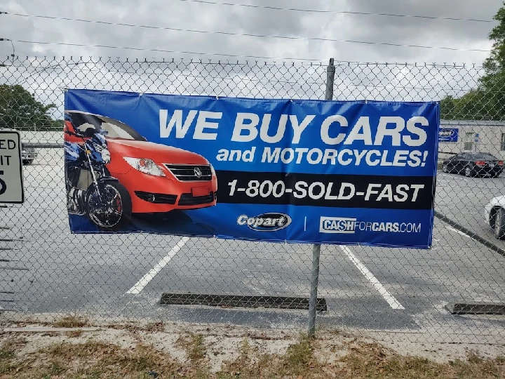 Banner advertising cash for cars and motorcycles.