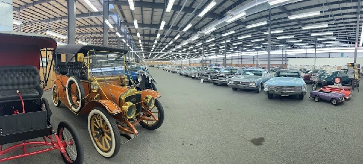 Classic cars in a spacious auto showcase.