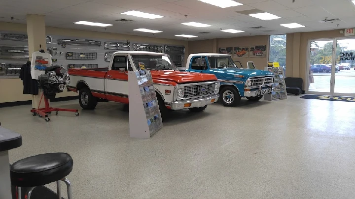 Classic trucks showcased in an LMC Truck showroom.