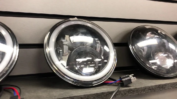 Custom motorcycle headlights on display.