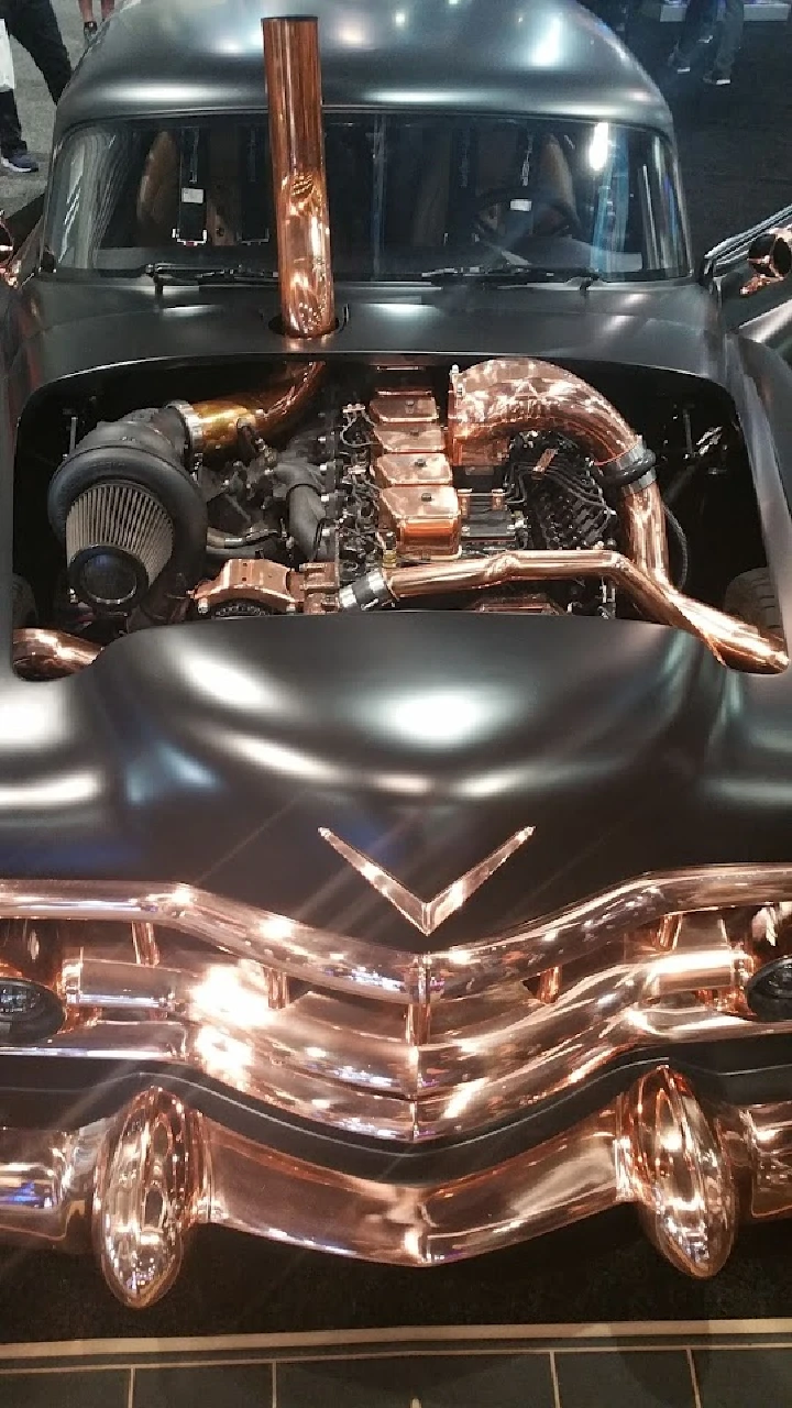 Customized engine with copper detailing showcased.