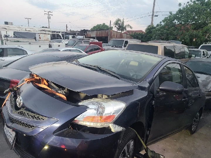 Damaged car awaiting junk removal in Los Angeles.