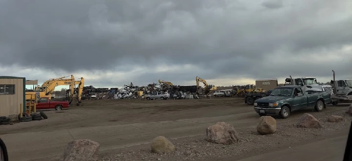 Dionisio Metal & Iron scrap yard with heavy machinery.