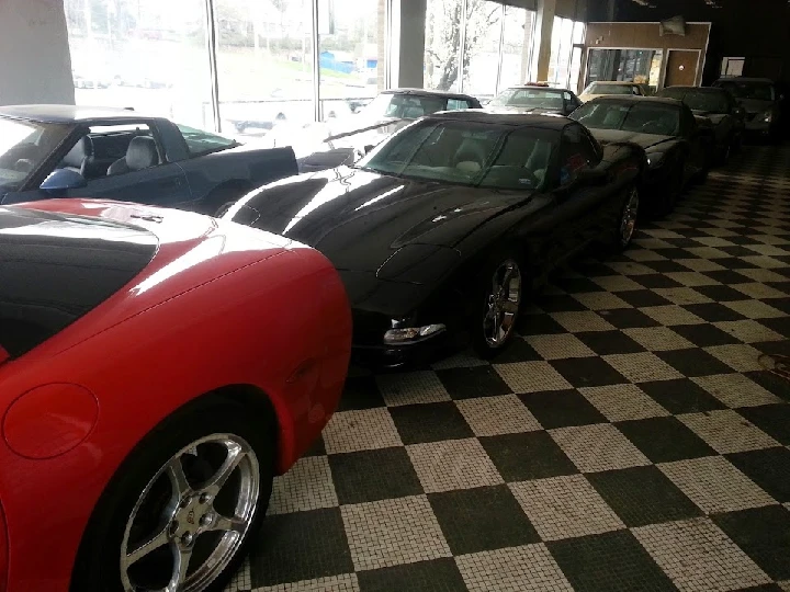 Luxury cars on display at Ajax Auto Parts Inc.