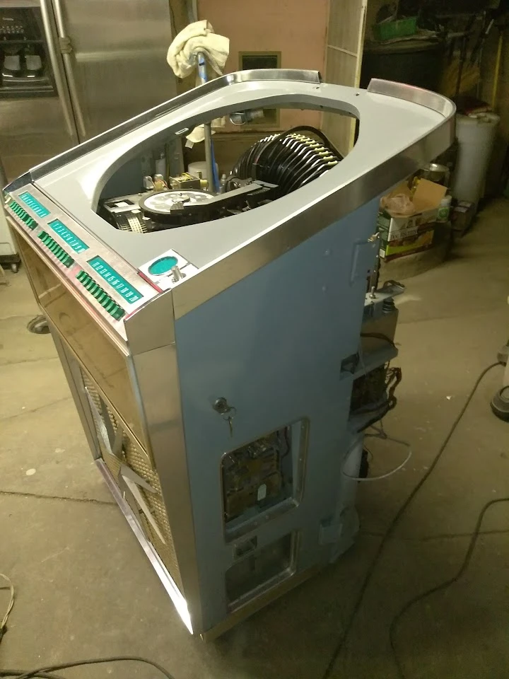 Old-style auto parts machine inside a workshop.