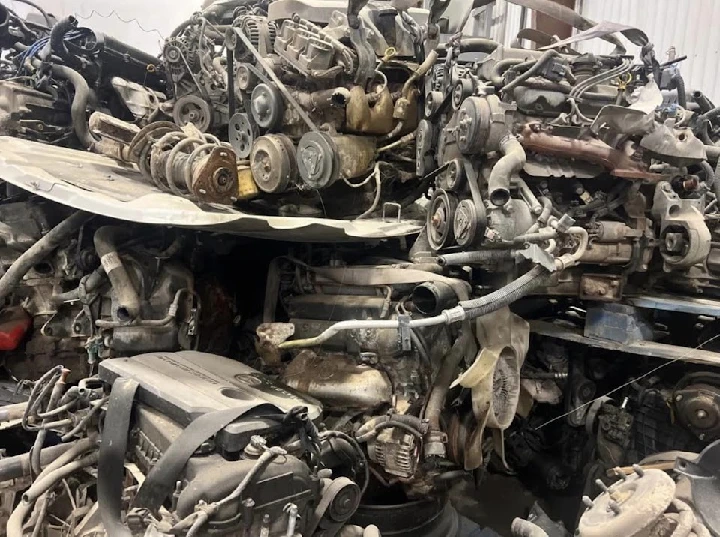 Piled auto engines at Del Paso Auto Dismantlers.