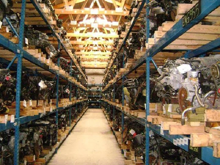 Rows of auto parts in a large warehouse.