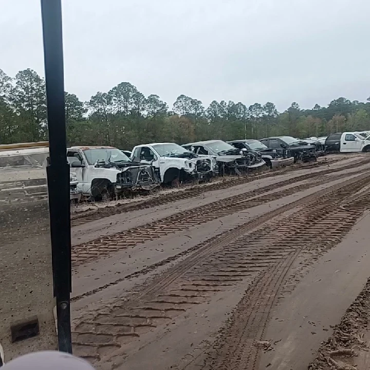 Rows of wrecked vehicles at Howell's Auto Parts.