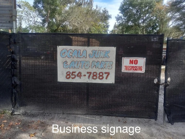 Signage for Ocala Junk & Auto Parts. No trespassing.