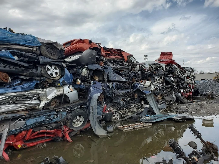 Stacked cars in a salvage yard at Harry's U-Pull-It.