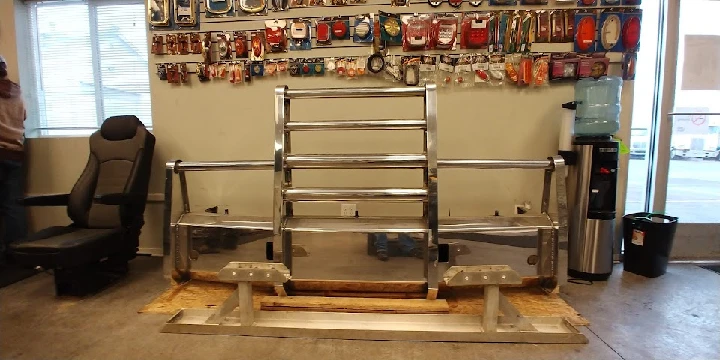 Steel truck parts displayed in a service area.