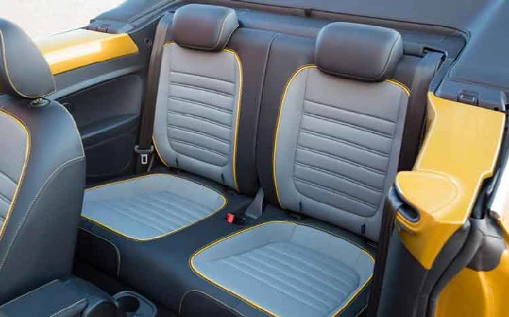 Stylish car interior seats with gray and yellow accents.