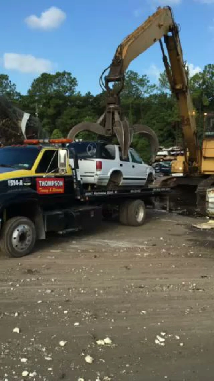 Towing a junk car at Thompson Junk Car Buyer.