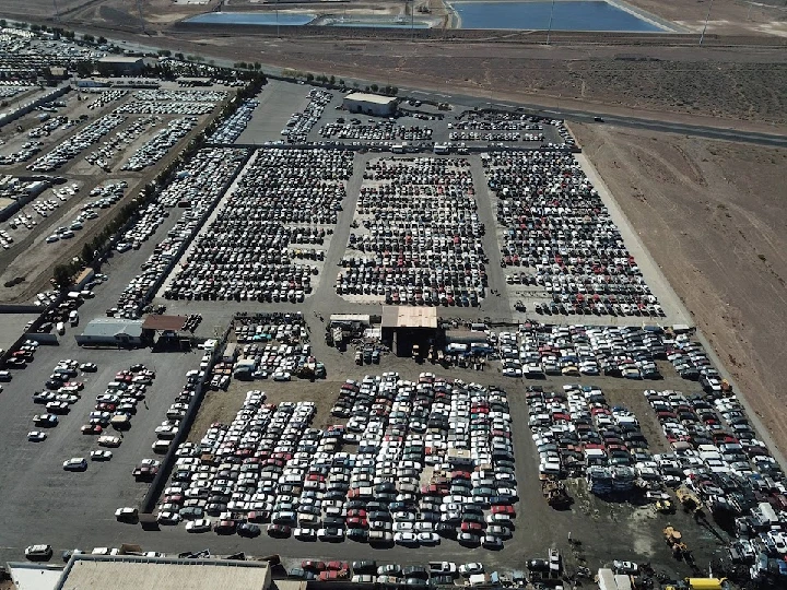 Aerial view of a large vehicle salvage yard.