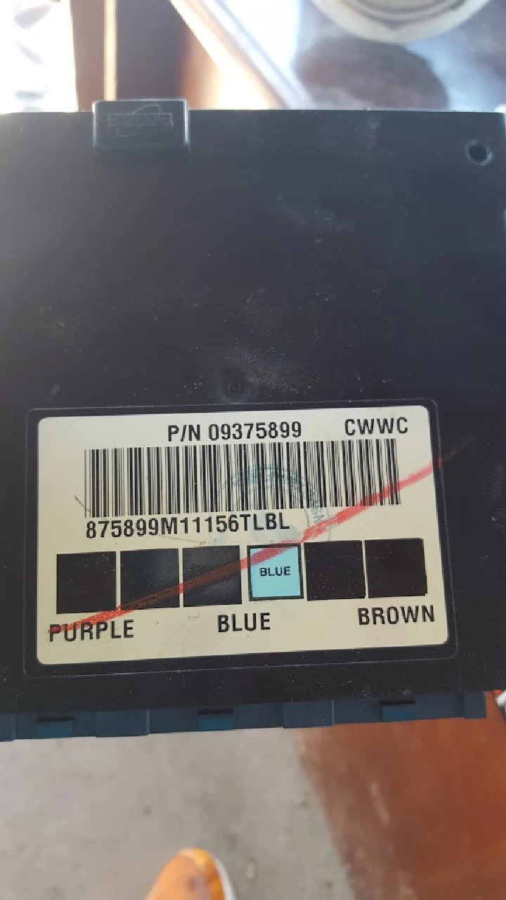 Auto parts label with color coding and barcode.