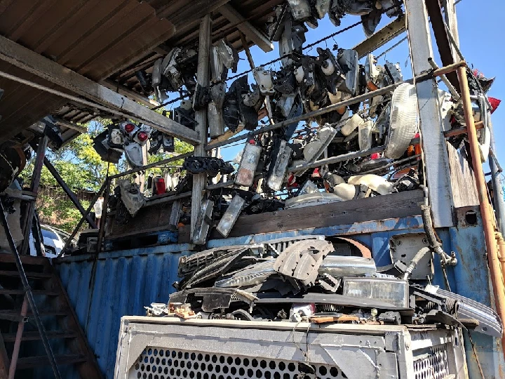 Auto parts stacked at J & J Auto Wreckers.