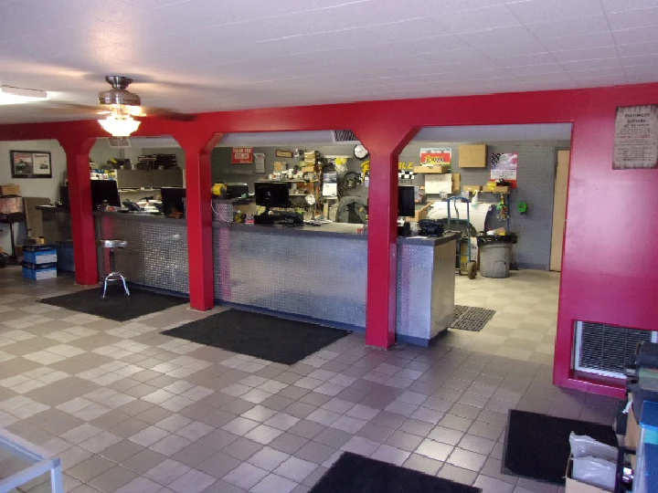 Auto parts store interior with service counters.