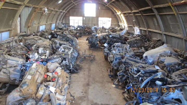 Auto parts warehouse filled with disassembled engines.