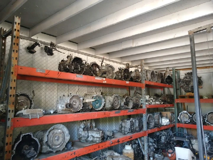 Auto salvage shelves filled with various engines.