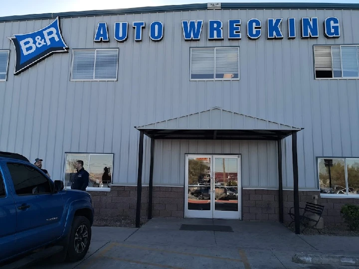 B&R Auto Wrecking building with blue signage.