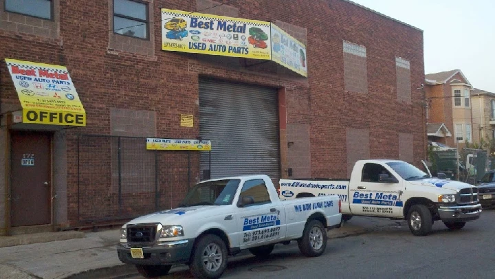 Best Metal Used Auto Parts storefront and trucks.