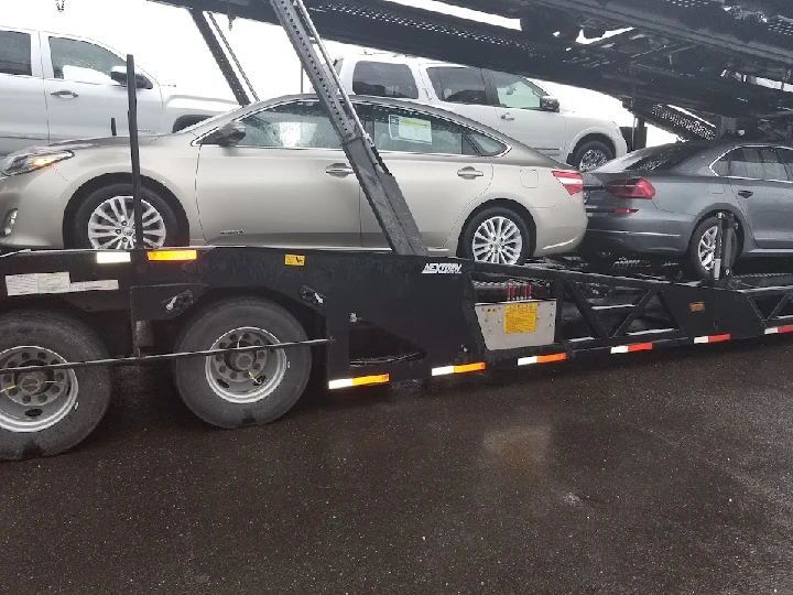 Cars loaded on a transport trailer at Keystone Automotive.