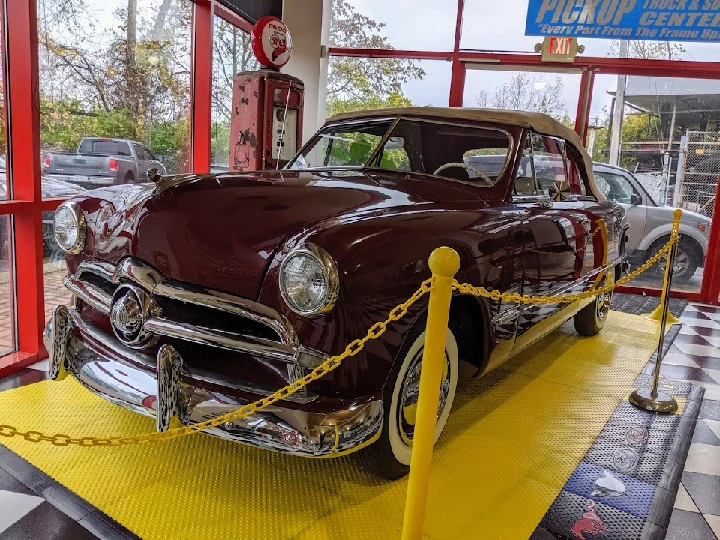 Classic car display at Central City Auto Parts.