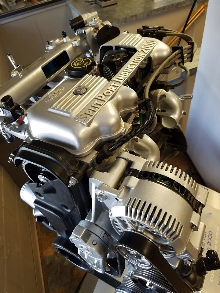 Close-up of a silver automotive engine.