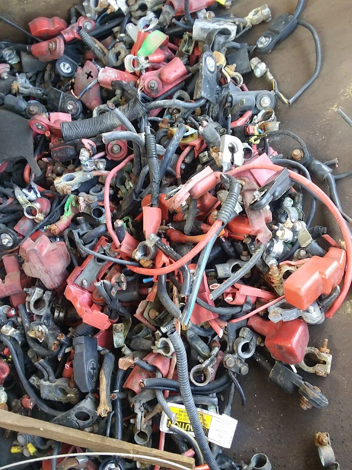 Collection of assorted battery cables and connectors.