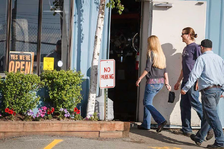 Customers entering Northwest Auto Parts store.