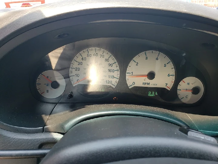 Dashboard with speed and fuel gauges displayed.