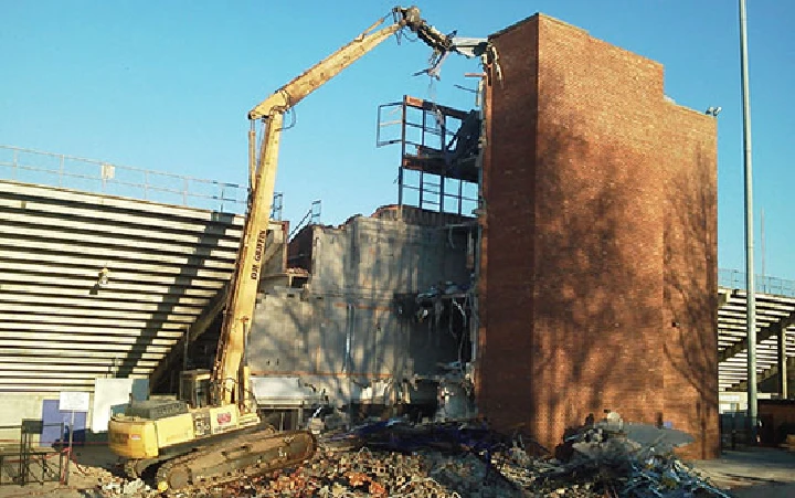 Demolition machinery at a scrap yard site.