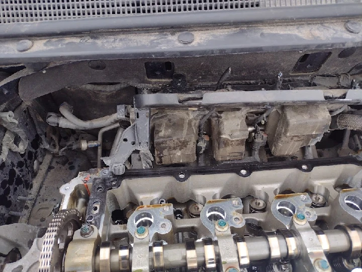 Engine components exposed in a vehicle.