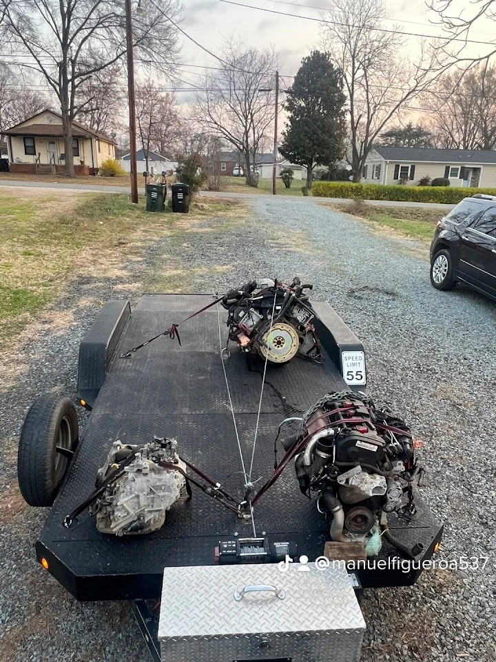 Engines loaded on a trailer for auto parts sale.