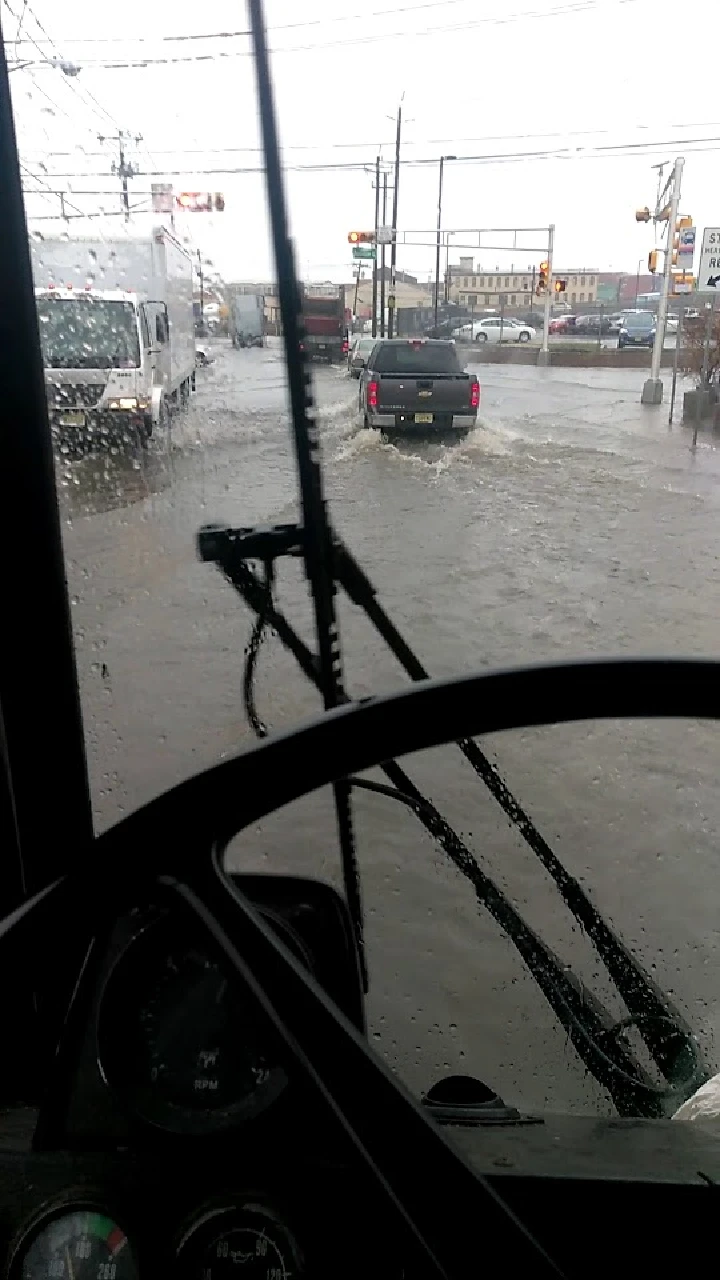 Flooded street view from a truck cabin.