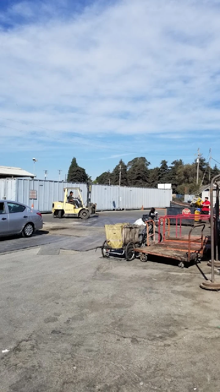 Forklift operating in a recycling yard.