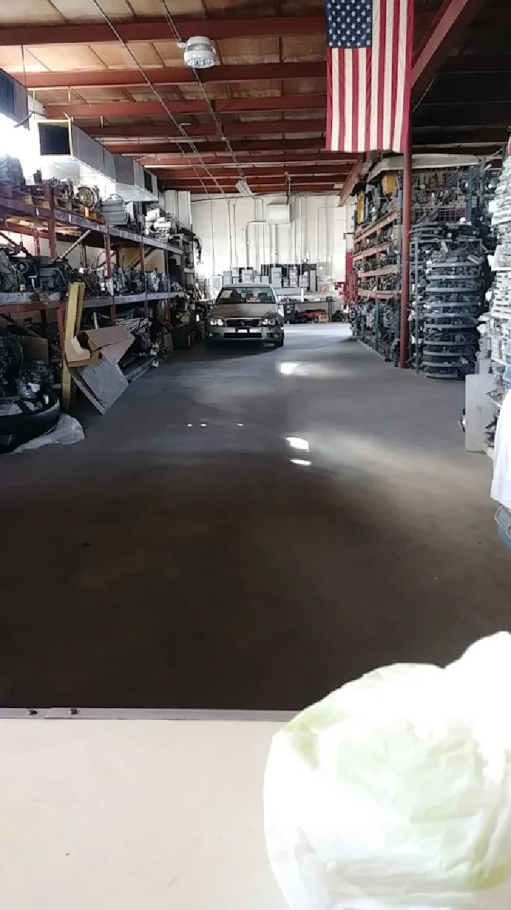 Interior of San Jose Used Auto Parts, with shelves.