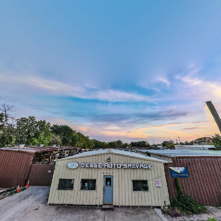 Jesse Auto Salvage Inc. building at sunset.